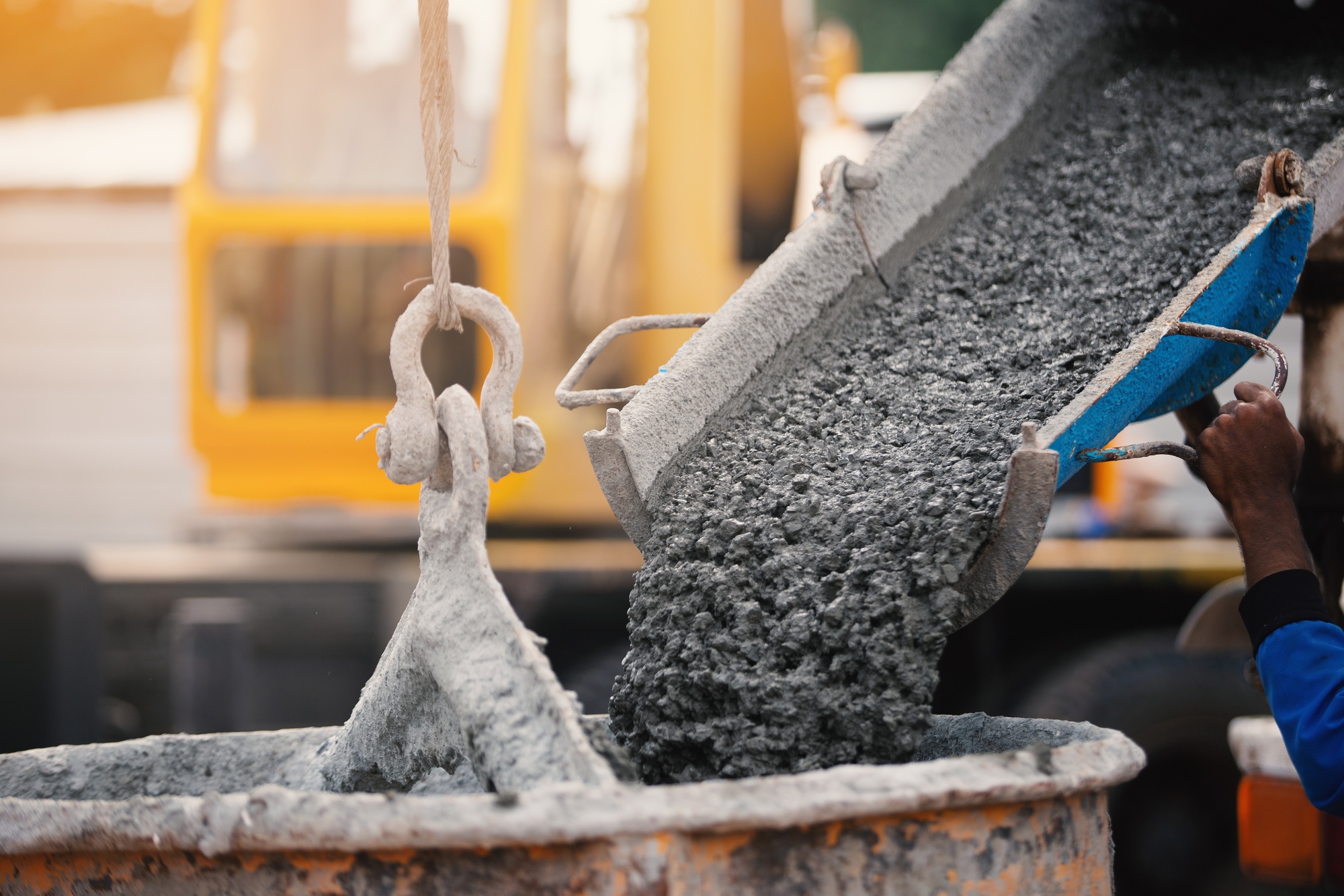 Stock Image - Bucket crane carring cement